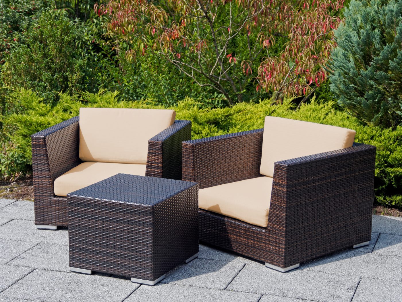 Group of outdoor furniture rattan armchairs with table on terrace